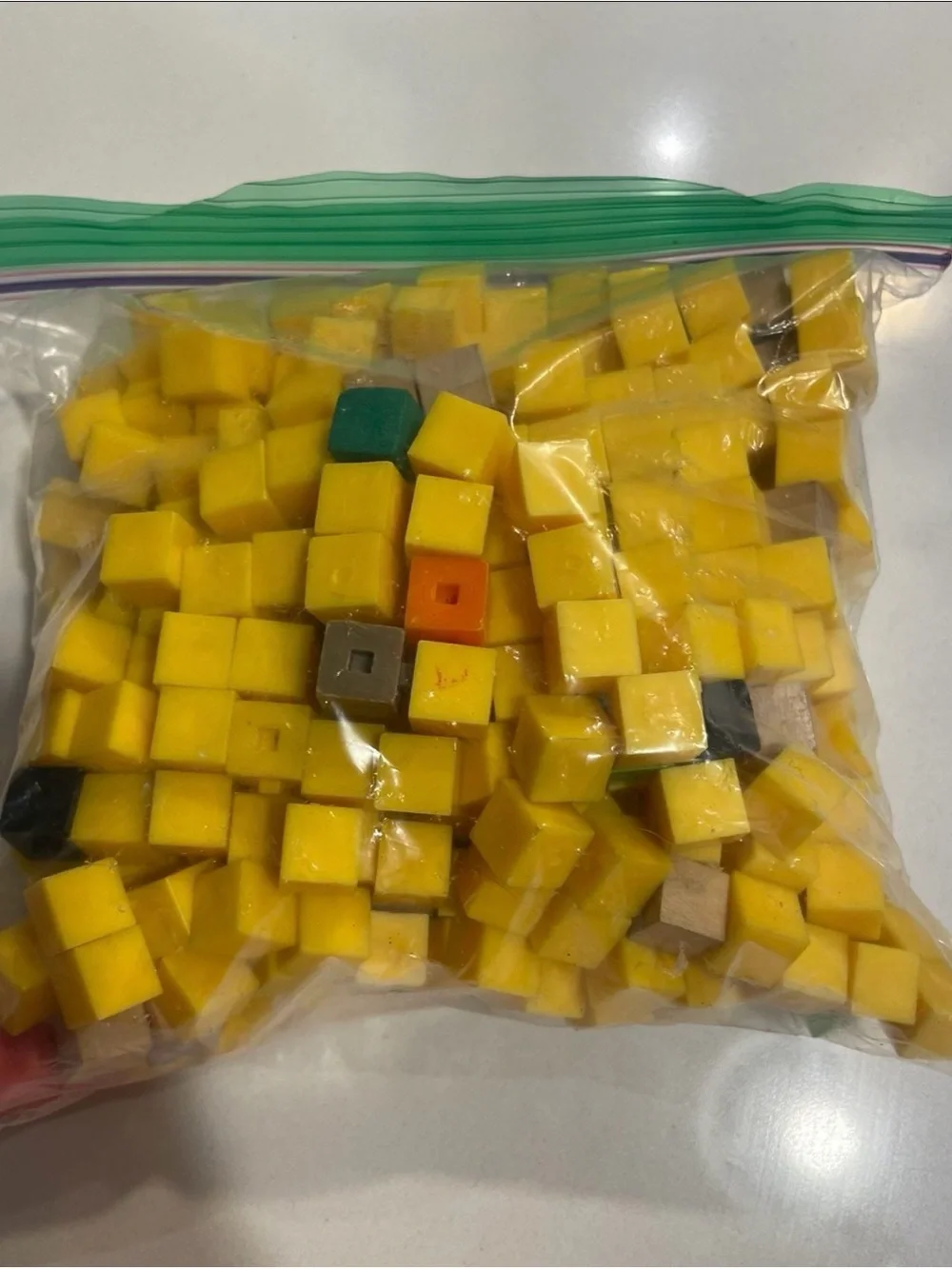 Bag of Yellow Wooden and Plastic Cubes with Assorted Accent Colors